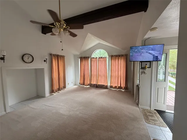 a view of an empty room with a window