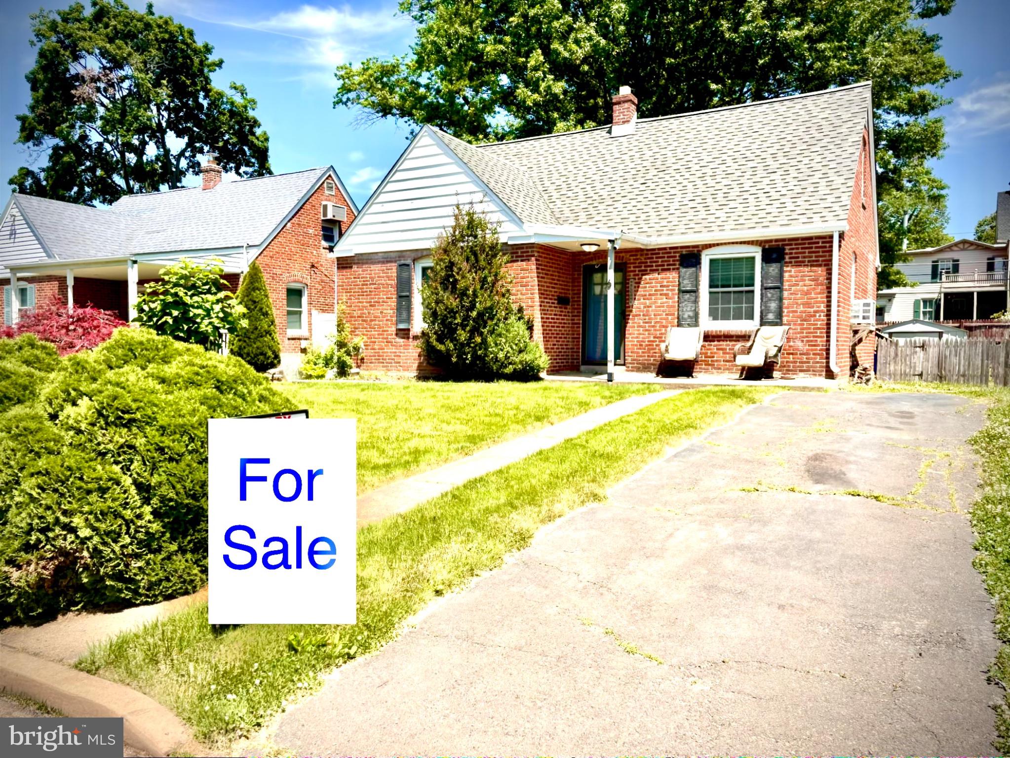 6 James Road Hatboro, PA 19040 - Photo 3 of 18 Charming brick home with lush greenery.
