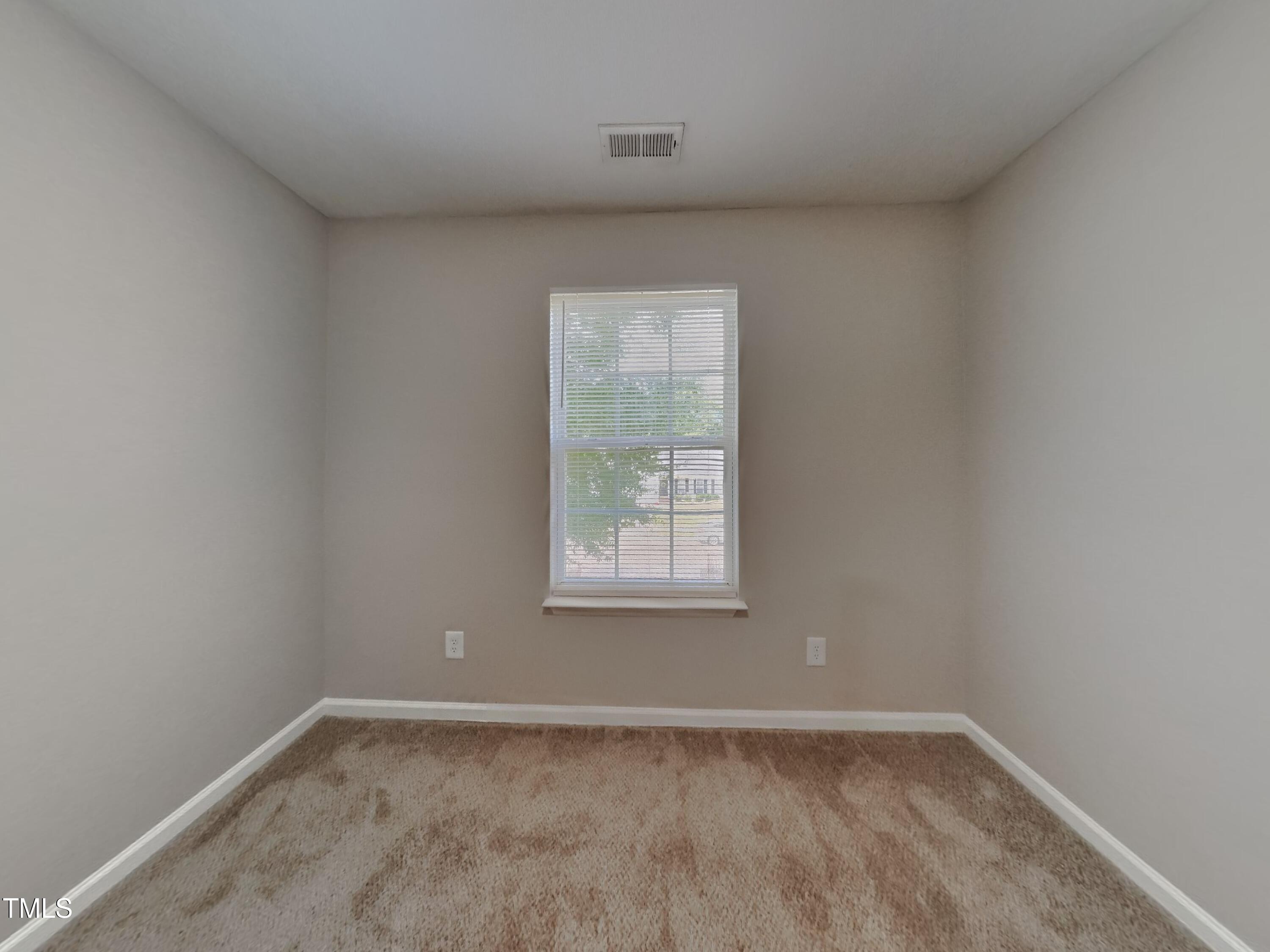 5416 Neuse Forest Road Raleigh, NC 27616 - Photo 11 of 15 an empty room with a window