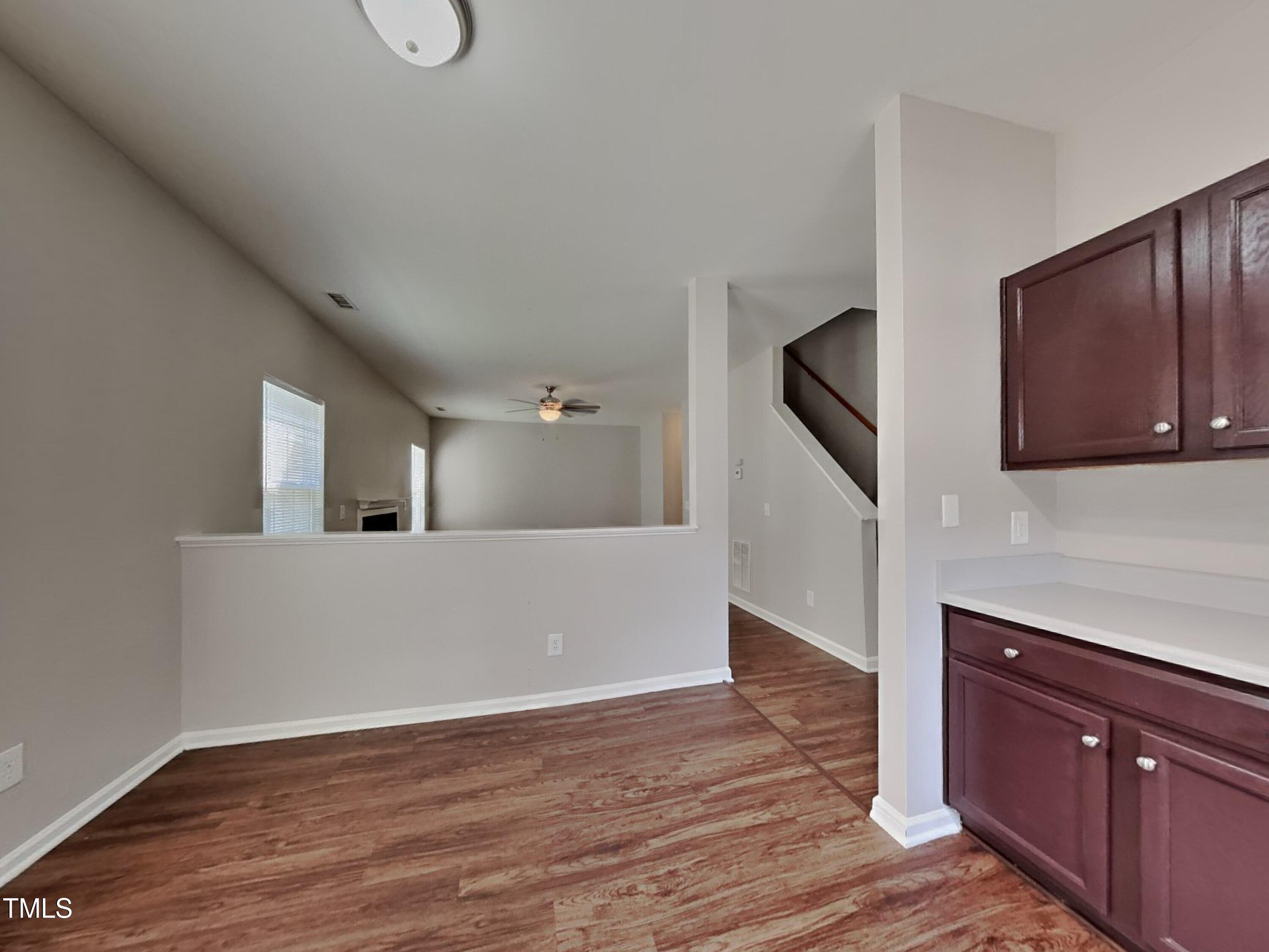 5416 Neuse Forest Road Raleigh, NC 27616 - Photo 6 of 15 a view of a kitchen with wooden floor and cabinets