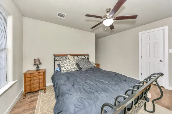 a bed room with a bed and dresser