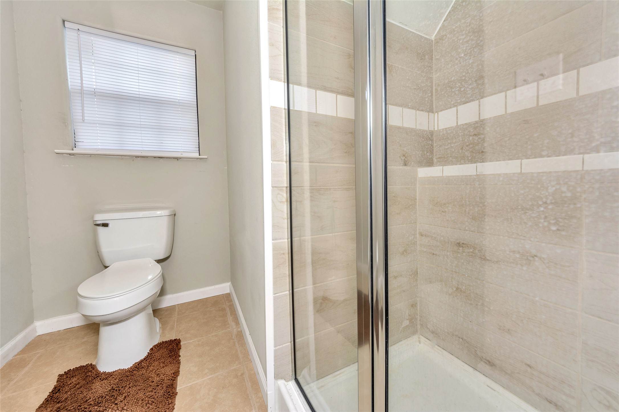 2581 County Road 156 Georgetown, TX 78626 - Photo 17 of 29 a bathroom with a toilet and a shower