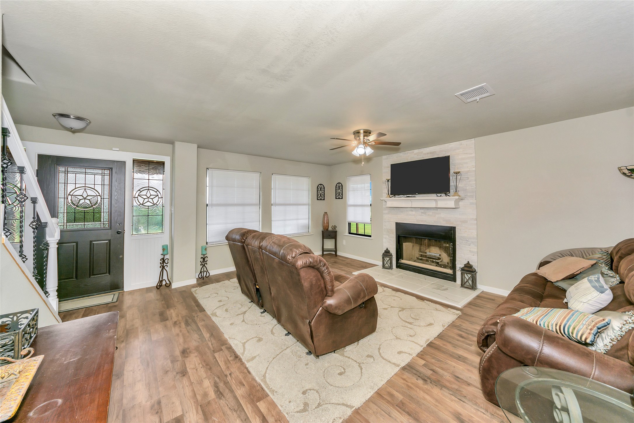 2581 County Road 156 Georgetown, TX 78626 - Photo 6 of 29 a living room with furniture a fireplace and a flat screen tv