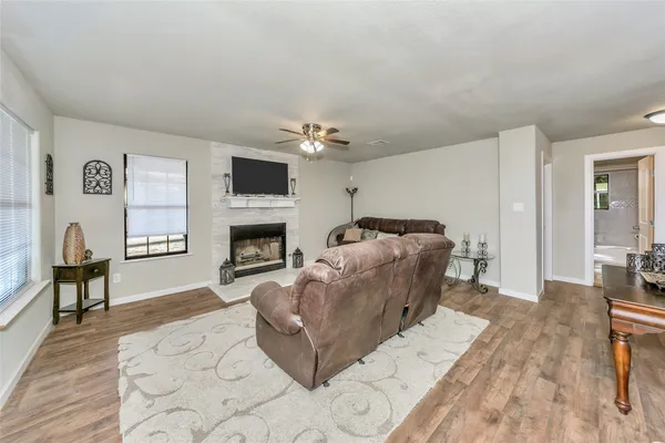 a bed room with furniture and a fireplace