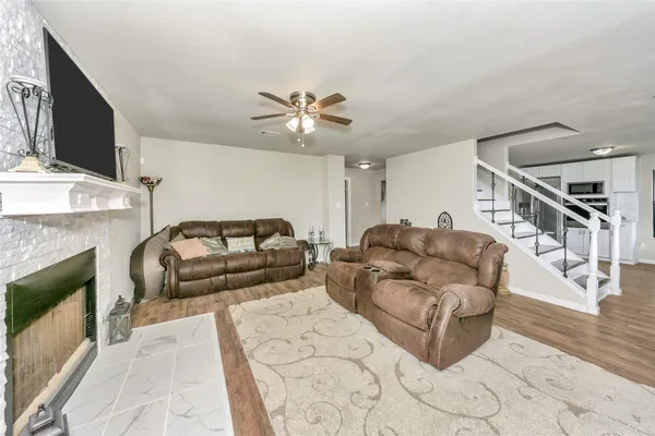 a living room with furniture and a fireplace