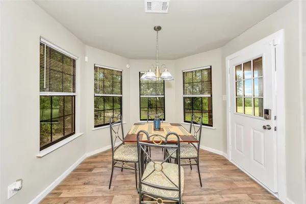 a view of a dining room with furniture window and outside view