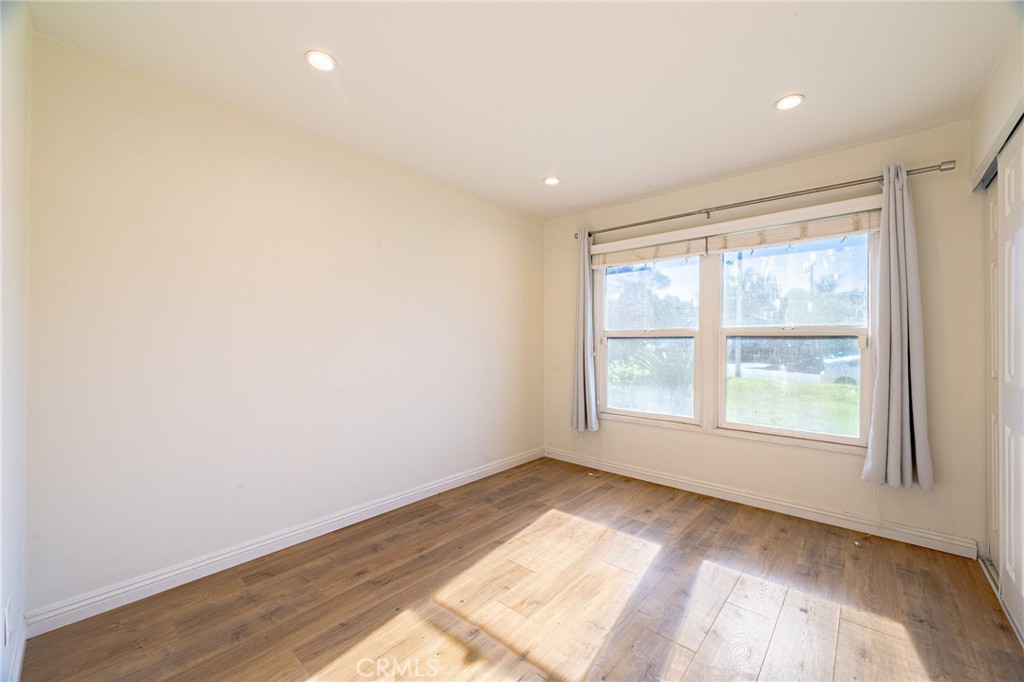 2270 Raleo Avenue Rowland Heights, CA 91748 - Photo 22 of 36 an empty room with wooden floor and windows