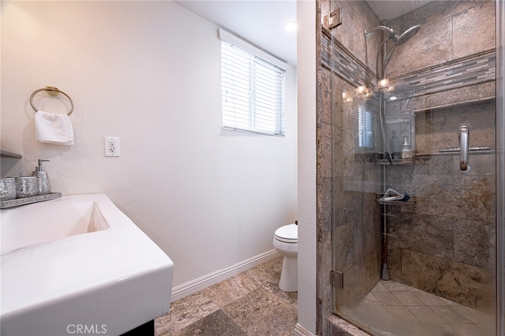 2270 Raleo Avenue Rowland Heights, CA 91748 - Photo 27 of 36 a bathroom with a sink a toilet and shower