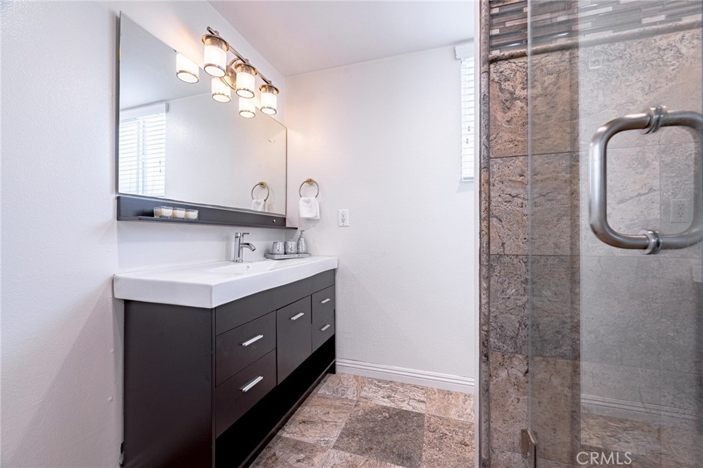 2270 Raleo Avenue Rowland Heights, CA 91748 - Photo 28 of 36 a bathroom with a double vanity sink mirror and shower
