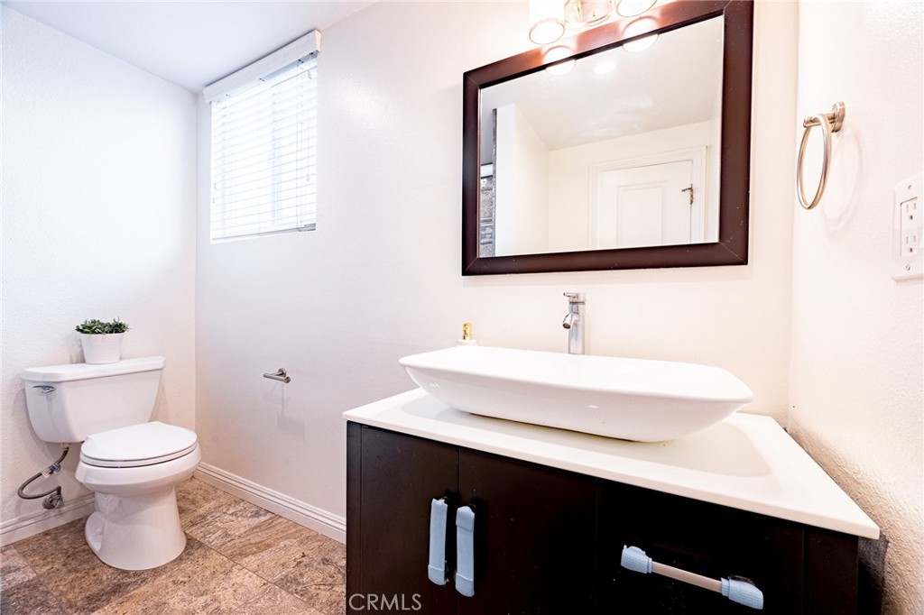2270 Raleo Avenue Rowland Heights, CA 91748 - Photo 29 of 36 a bathroom with a sink vanity and a toilet