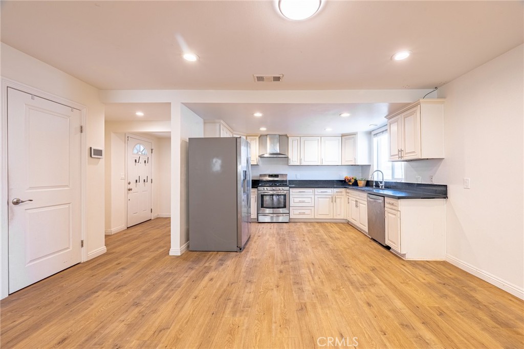 2270 Raleo Avenue Rowland Heights, CA 91748 - Photo 4 of 36 a kitchen with a refrigerator and a sink