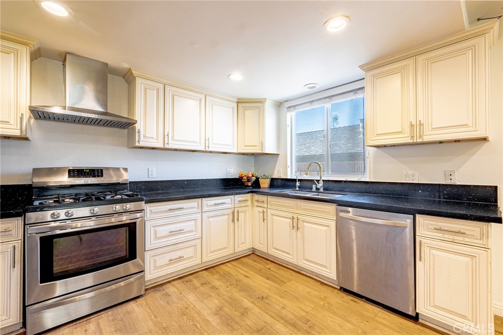 2270 Raleo Avenue Rowland Heights, CA 91748 - Photo 6 of 36 a kitchen with granite countertop white cabinets and appliances