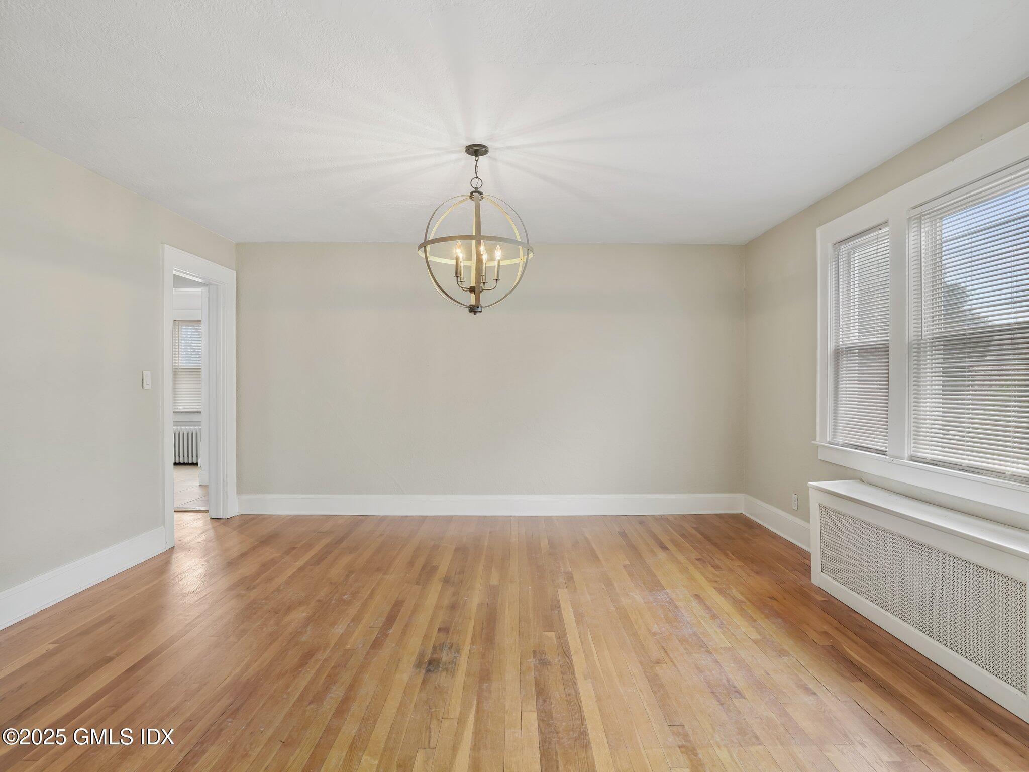 37 High Street, Unit 2 Greenwich, CT 06830 - Photo 8 of 23 a view of a room with wooden floor and chandelier