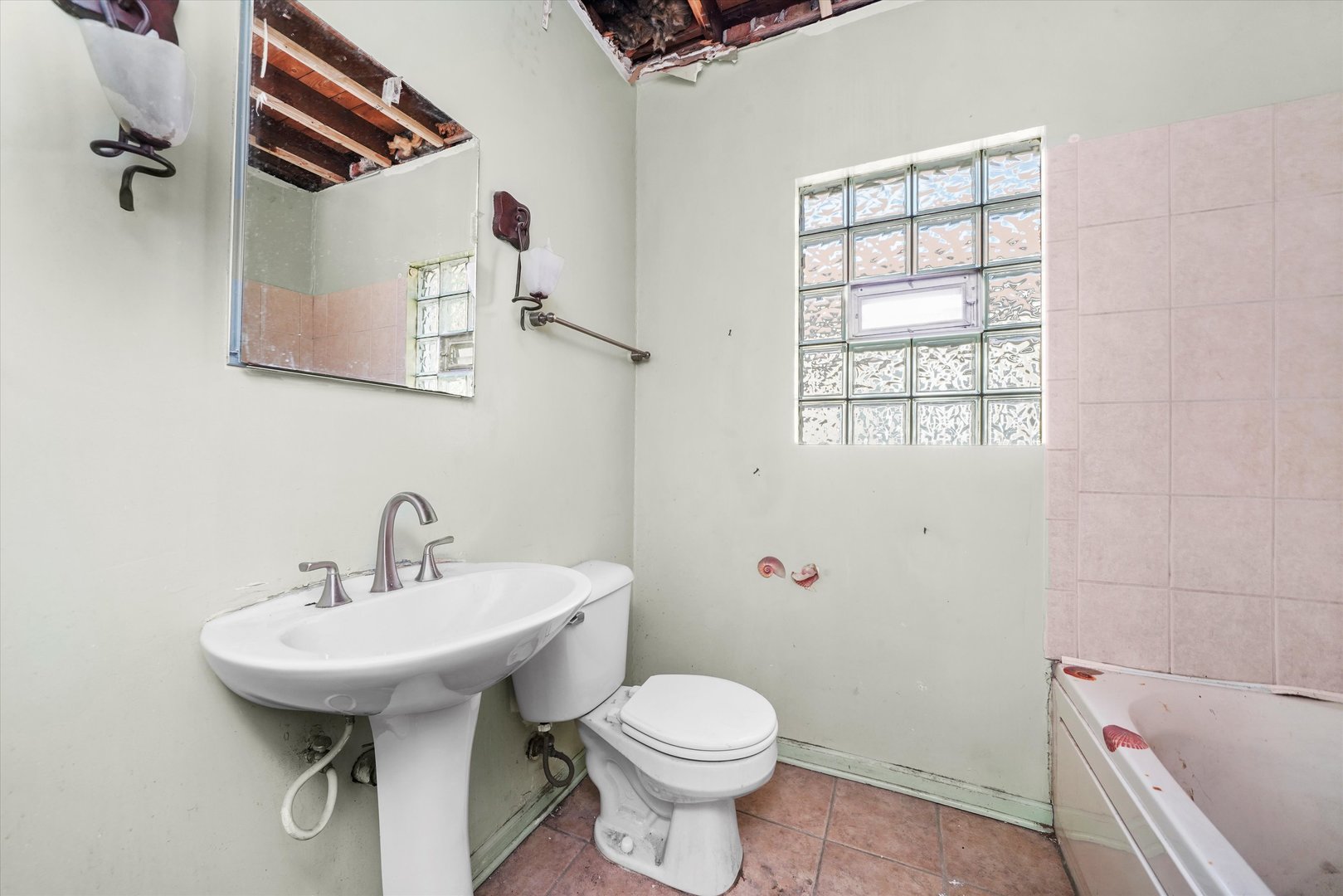 1430 South 10th Avenue Maywood, IL 60153 - Photo 11 of 29 a bathroom with a sink toilet and shower