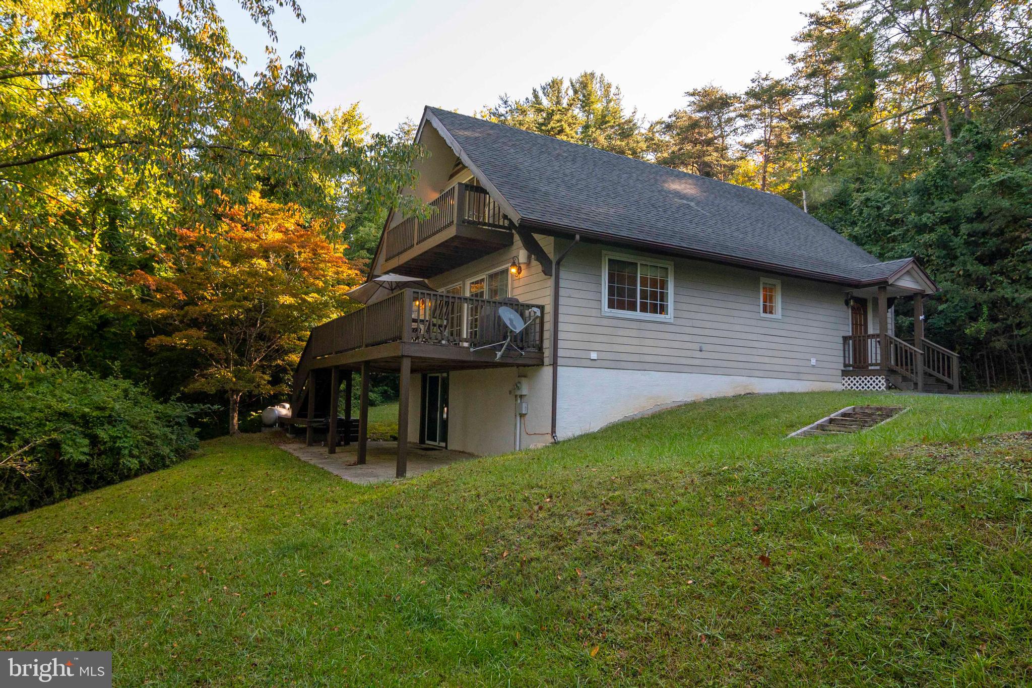 125 Fritzel Way Basye, VA 22842 - Photo 15 of 72 a front view of a house with garden