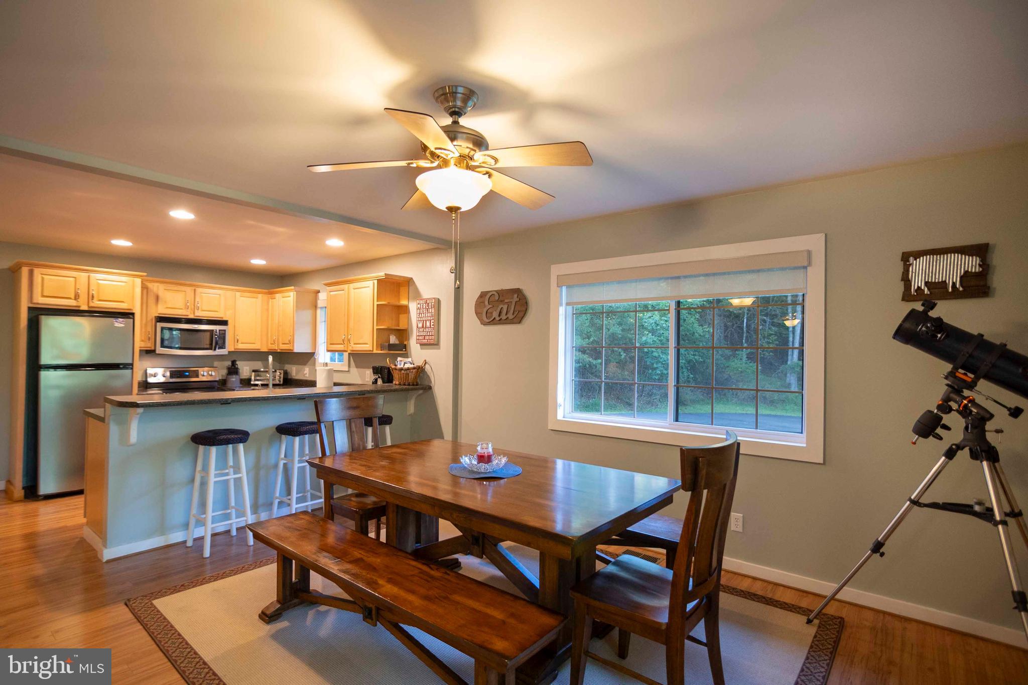 125 Fritzel Way Basye, VA 22842 - Photo 31 of 72 a view of a dining room with furniture window and wooden floor