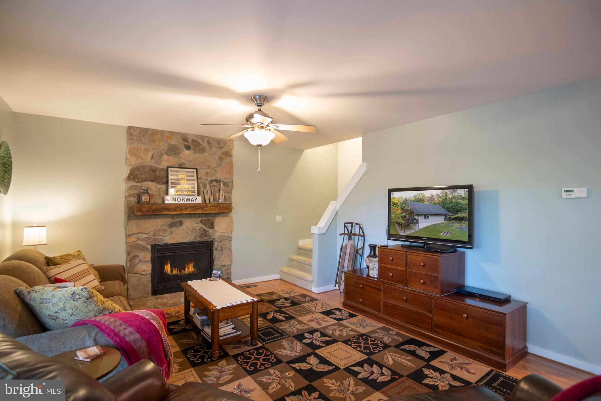 125 Fritzel Way Basye, VA 22842 - Photo 32 of 72 a living room with furniture and a fireplace