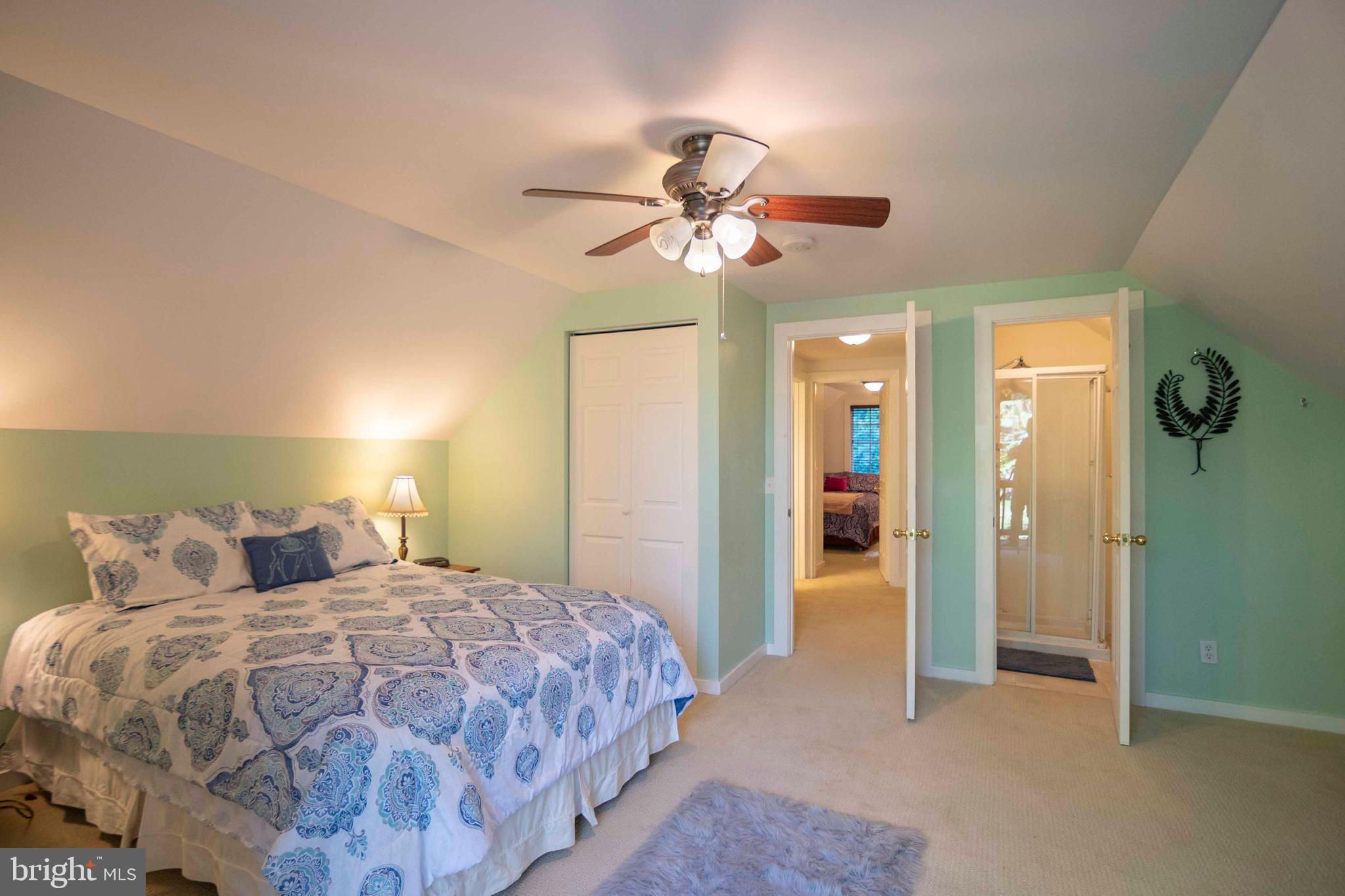 125 Fritzel Way Basye, VA 22842 - Photo 40 of 72 a bedroom with a bed and a chandelier