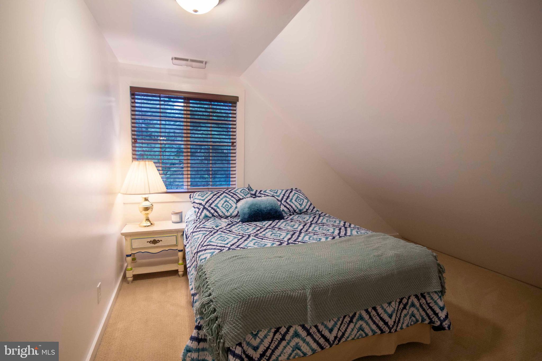 125 Fritzel Way Basye, VA 22842 - Photo 45 of 72 a bedroom with a bed and window