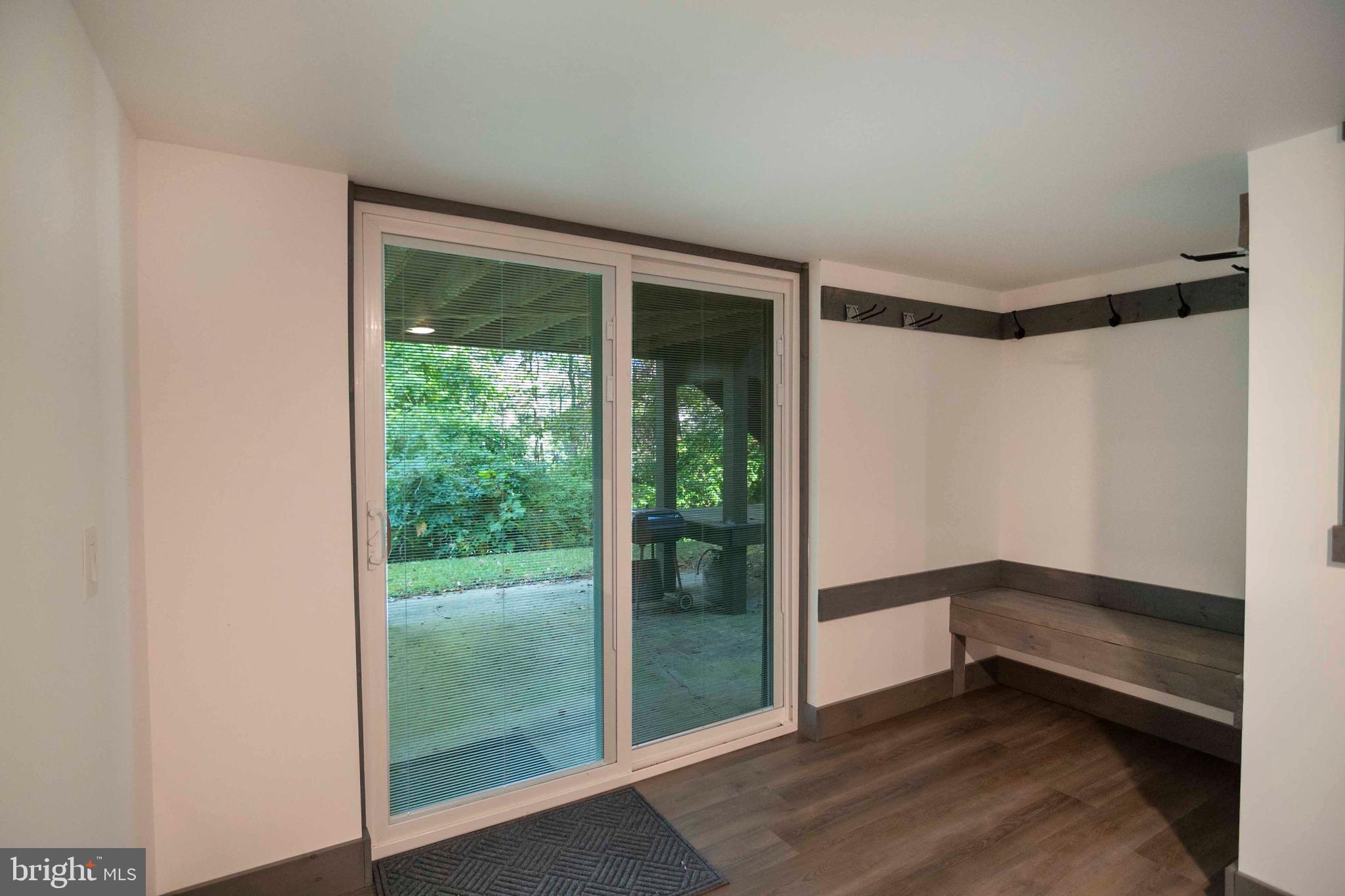 125 Fritzel Way Basye, VA 22842 - Photo 52 of 72 a view of an empty room with wooden floor and a window