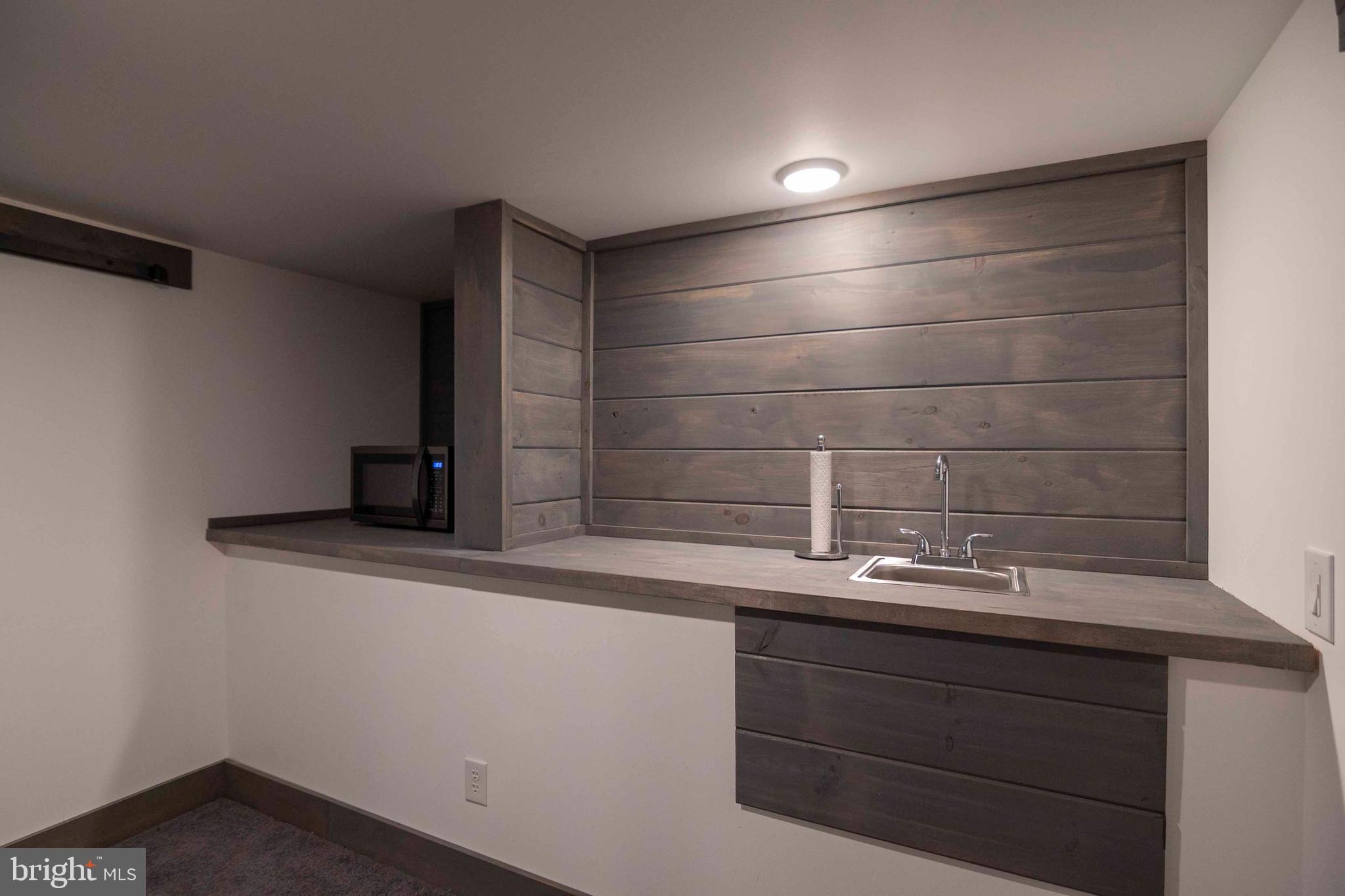 125 Fritzel Way Basye, VA 22842 - Photo 57 of 72 a bathroom with a sink and a mirror