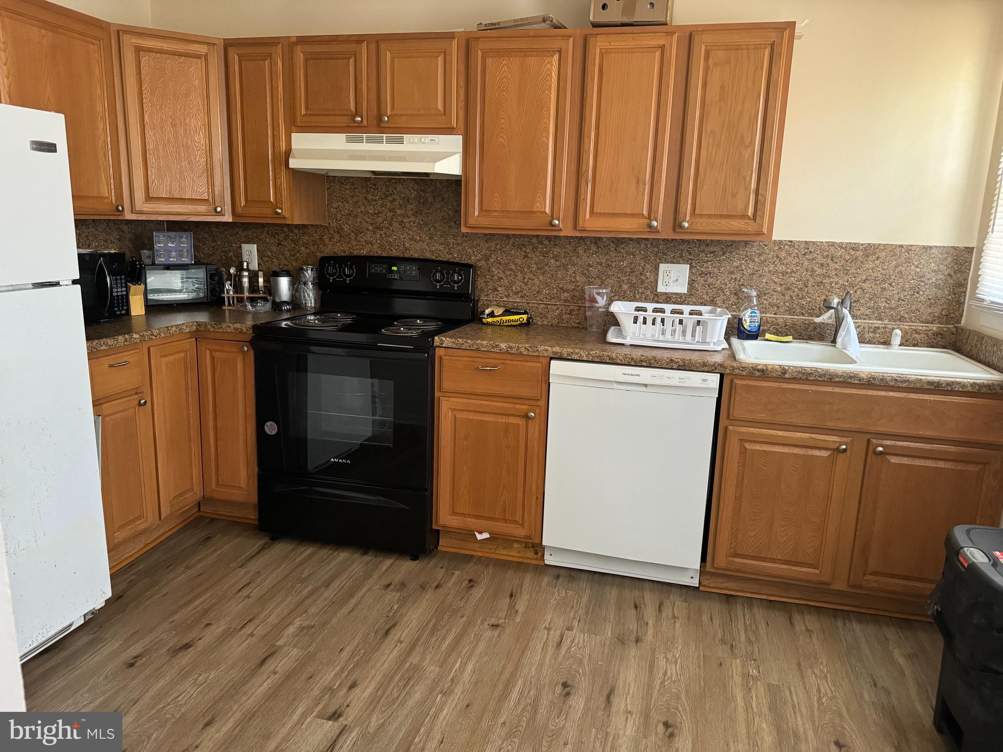 1020 Erial Road, Unit 2 Pine Hill, NJ 08021 - Photo 13 of 17 a kitchen with a sink and a stove top oven