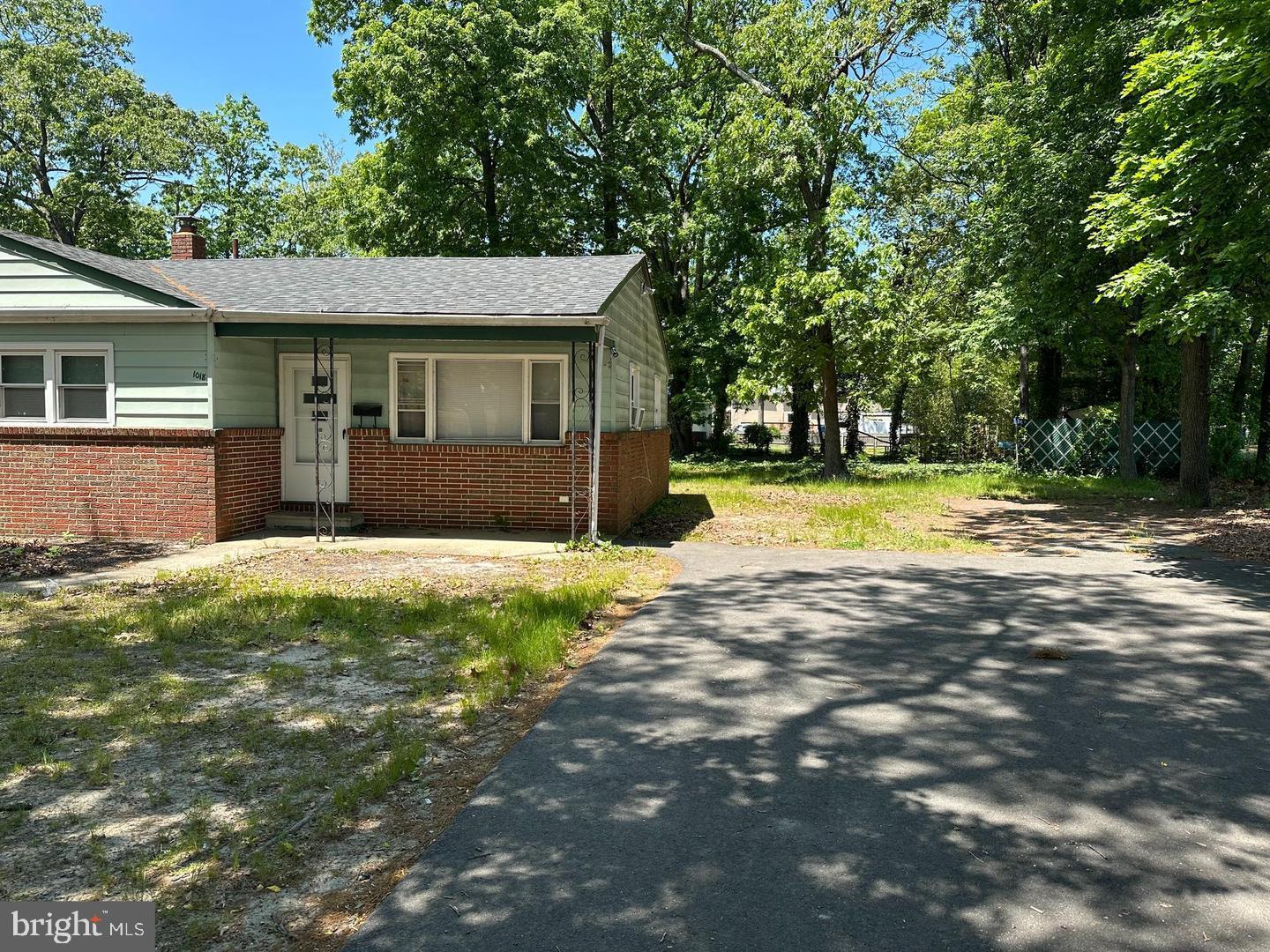 1020 Erial Road, Unit 2 Pine Hill, NJ 08021 - Photo 17 of 17 a view of a house with a yard and garage