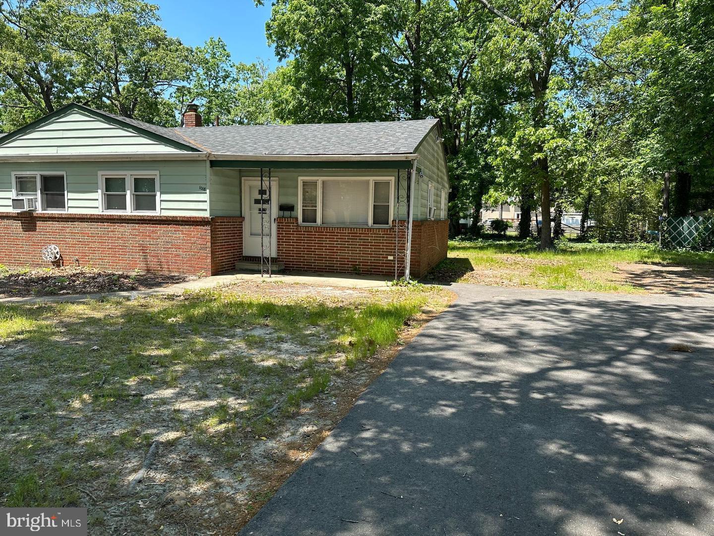 1020 Erial Road, Unit 2 Pine Hill, NJ 08021 - Photo 2 of 17 a front view of a house with a yard