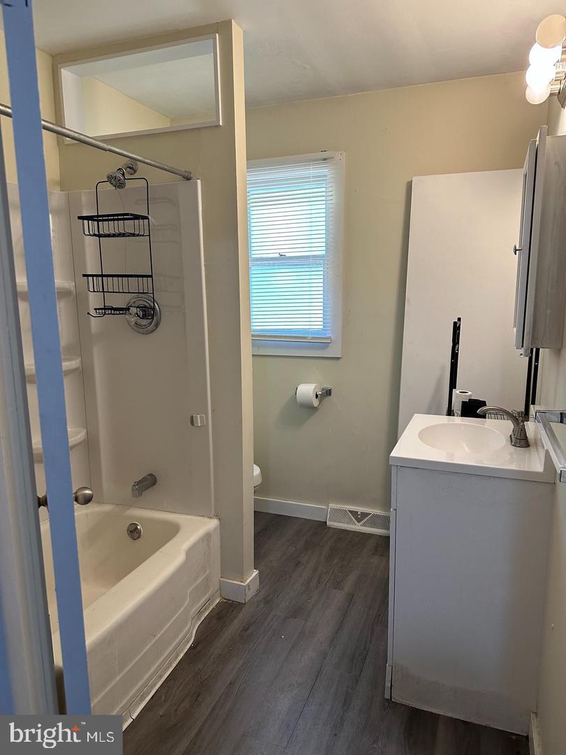 1020 Erial Road, Unit 2 Pine Hill, NJ 08021 - Photo 6 of 17 a bathroom with a tub sink and mirror