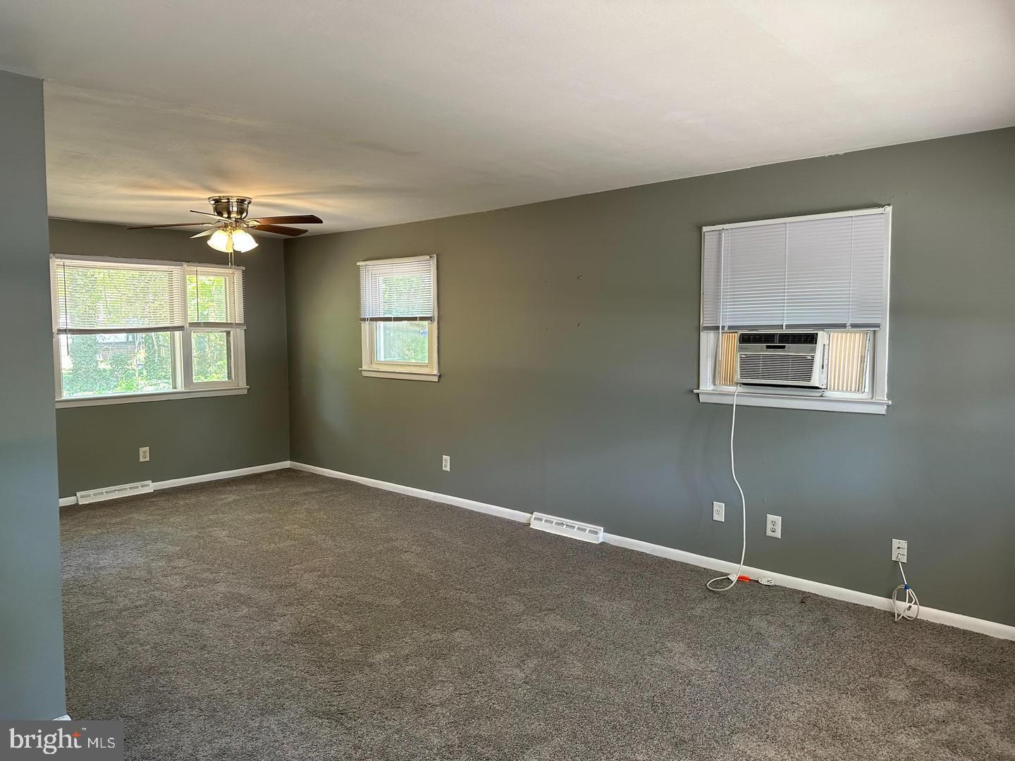 1020 Erial Road, Unit 2 Pine Hill, NJ 08021 - Photo 7 of 17 an empty room with windows and ceiling fan