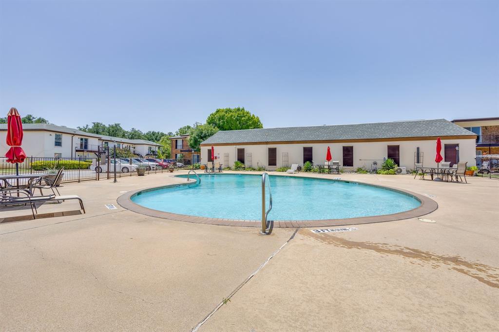 4102 Ridglea Country Club Drive, Unit 1503 Fort Worth, TX 76126 - Photo 2 of 21 Community swimming pool with surrounding concrete decking