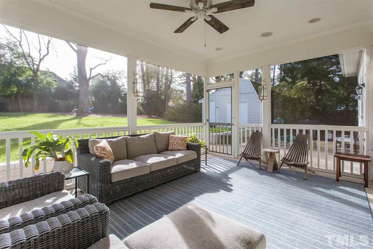 2808 Claremont Road Raleigh, NC 27608 - Photo 22 of 24 a balcony with furniture and a garden view