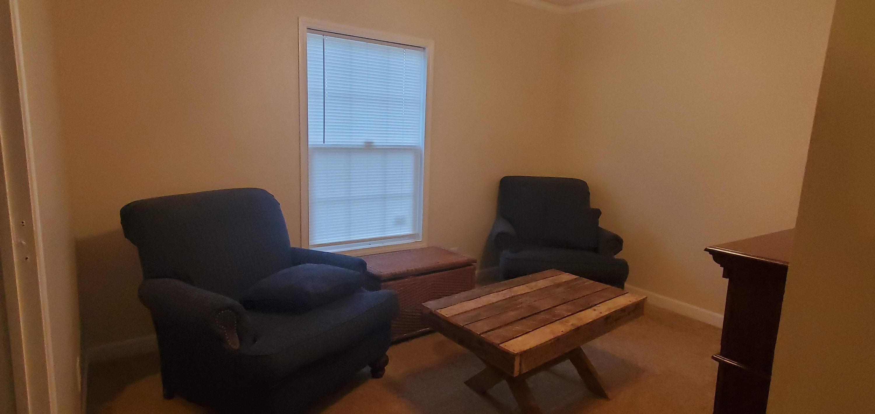160 Northridge Road Hardy, VA 24101 - Photo 17 of 42 a blue chair sitting in a room next to a window