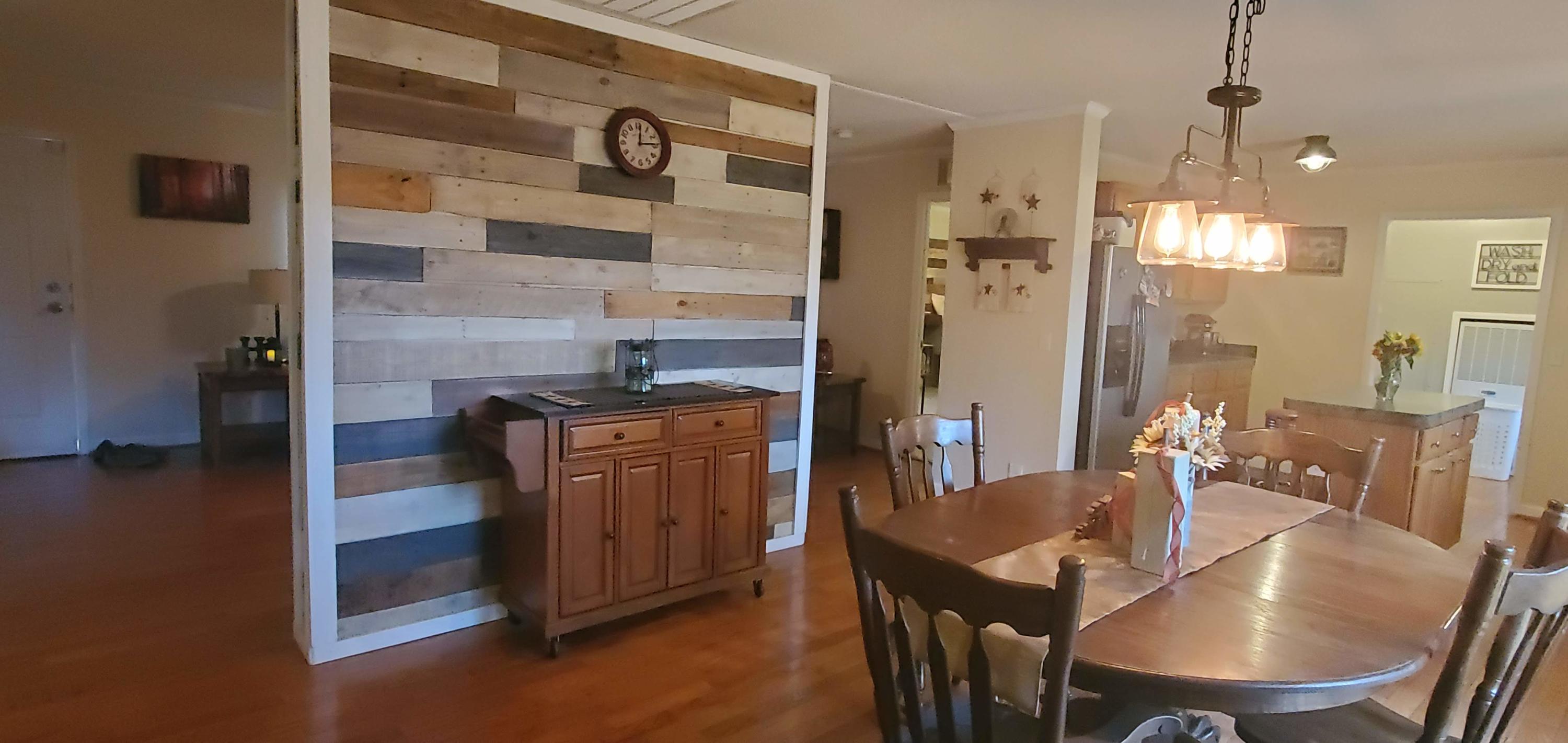 160 Northridge Road Hardy, VA 24101 - Photo 5 of 42 a view of a dining room with furniture a chandelier and wooden floor