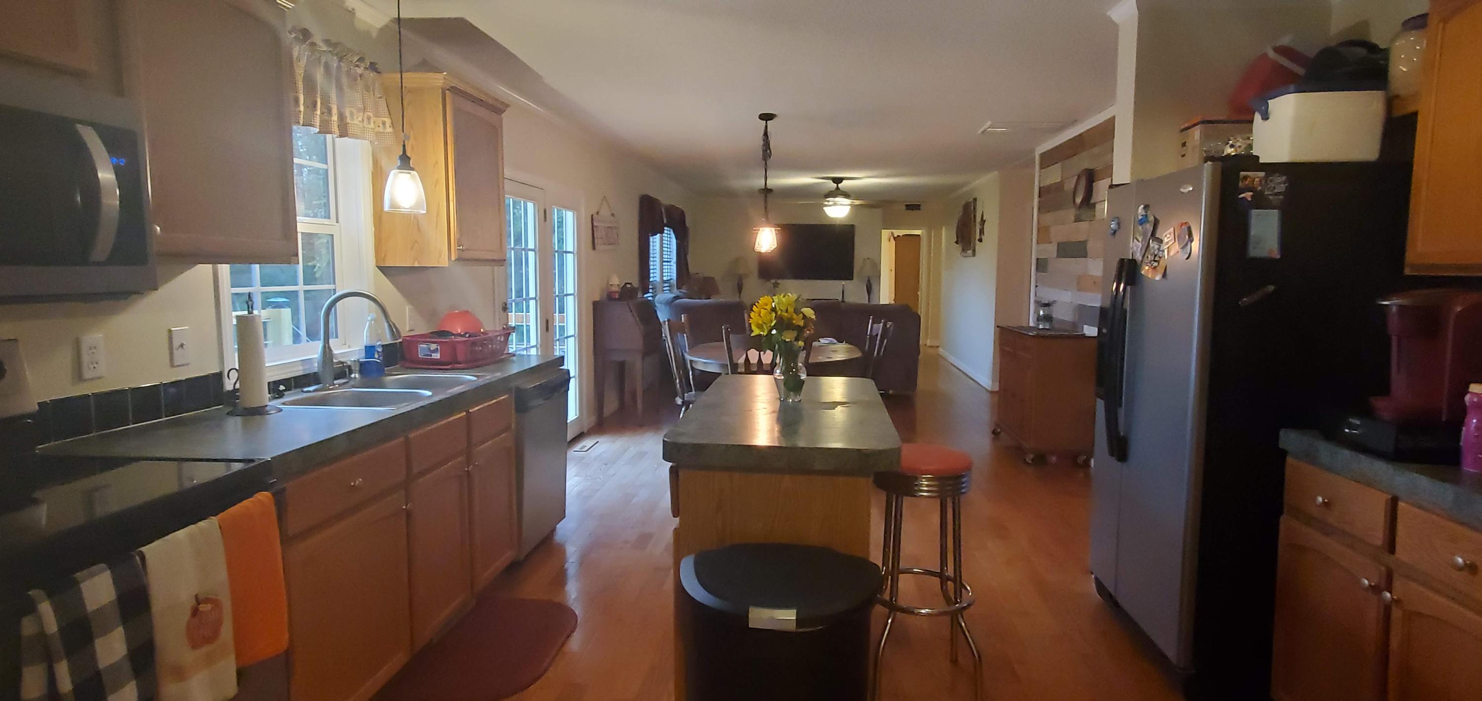 160 Northridge Road Hardy, VA 24101 - Photo 6 of 42 a kitchen with stainless steel appliances kitchen island granite countertop a sink stove and refrigerator
