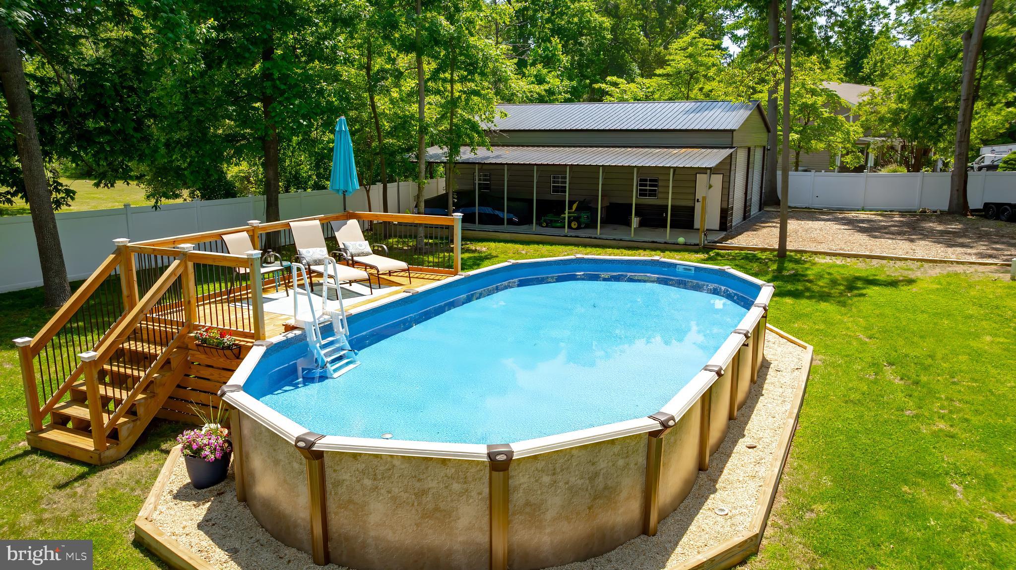 8331 Woodland Road Pasadena, MD 21122 - Photo 44 of 63 Above Ground pool with Deck