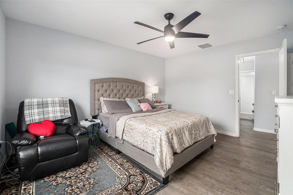 7403 Northeast 22nd Ct Road Ocala, FL 34479 - Photo 22 of 37 a bedroom with a bed closet and bedroom