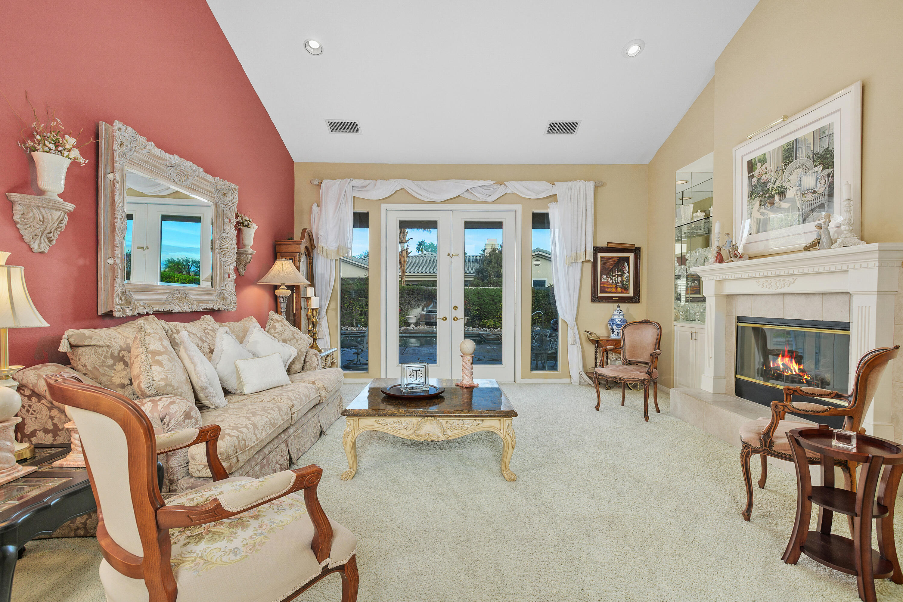 2 Othello Court Rancho Mirage, CA 92270 - Photo 11 of 45 a living room with furniture and a fireplace