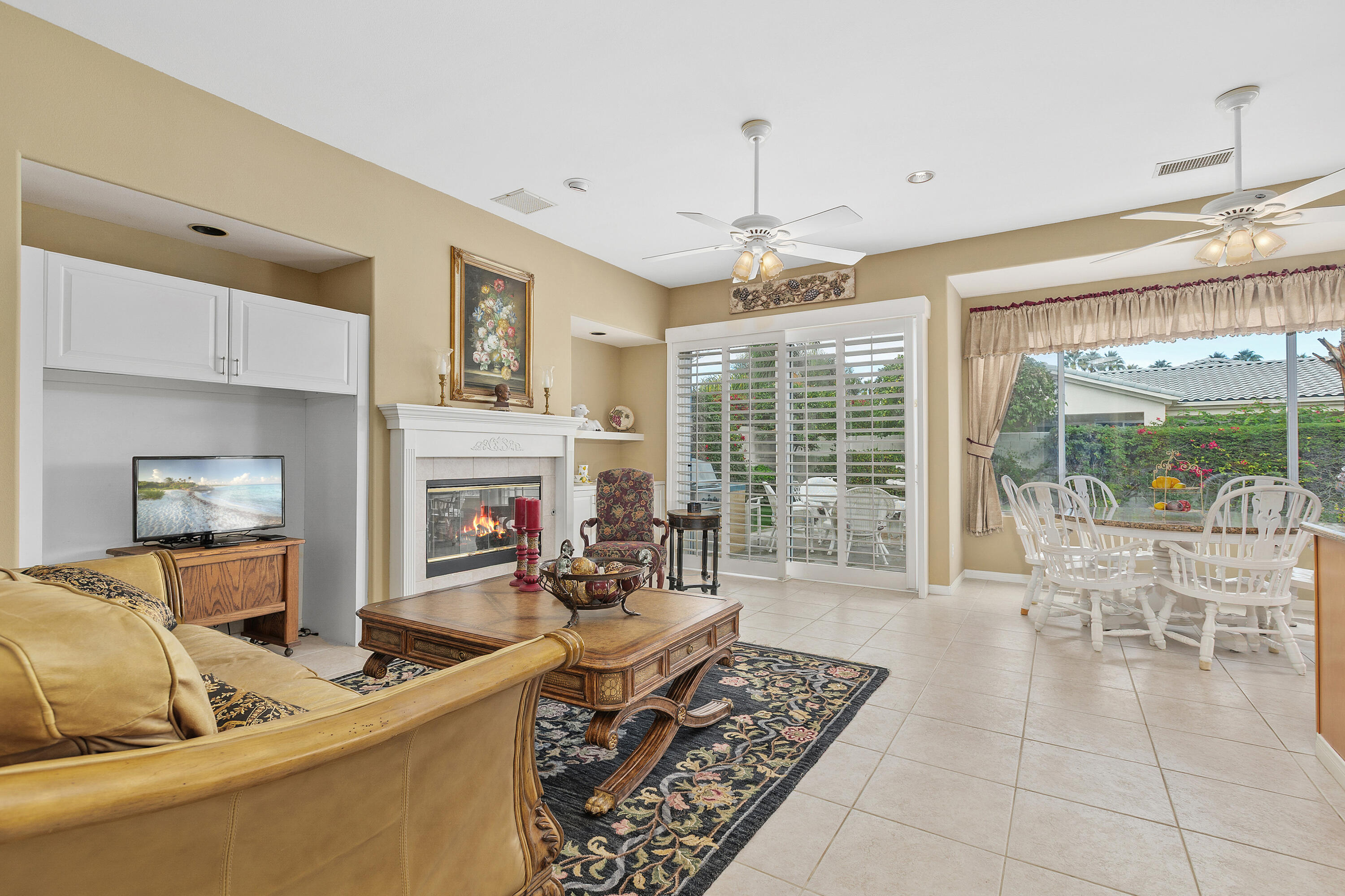 2 Othello Court Rancho Mirage, CA 92270 - Photo 12 of 45 a living room with furniture and a fireplace