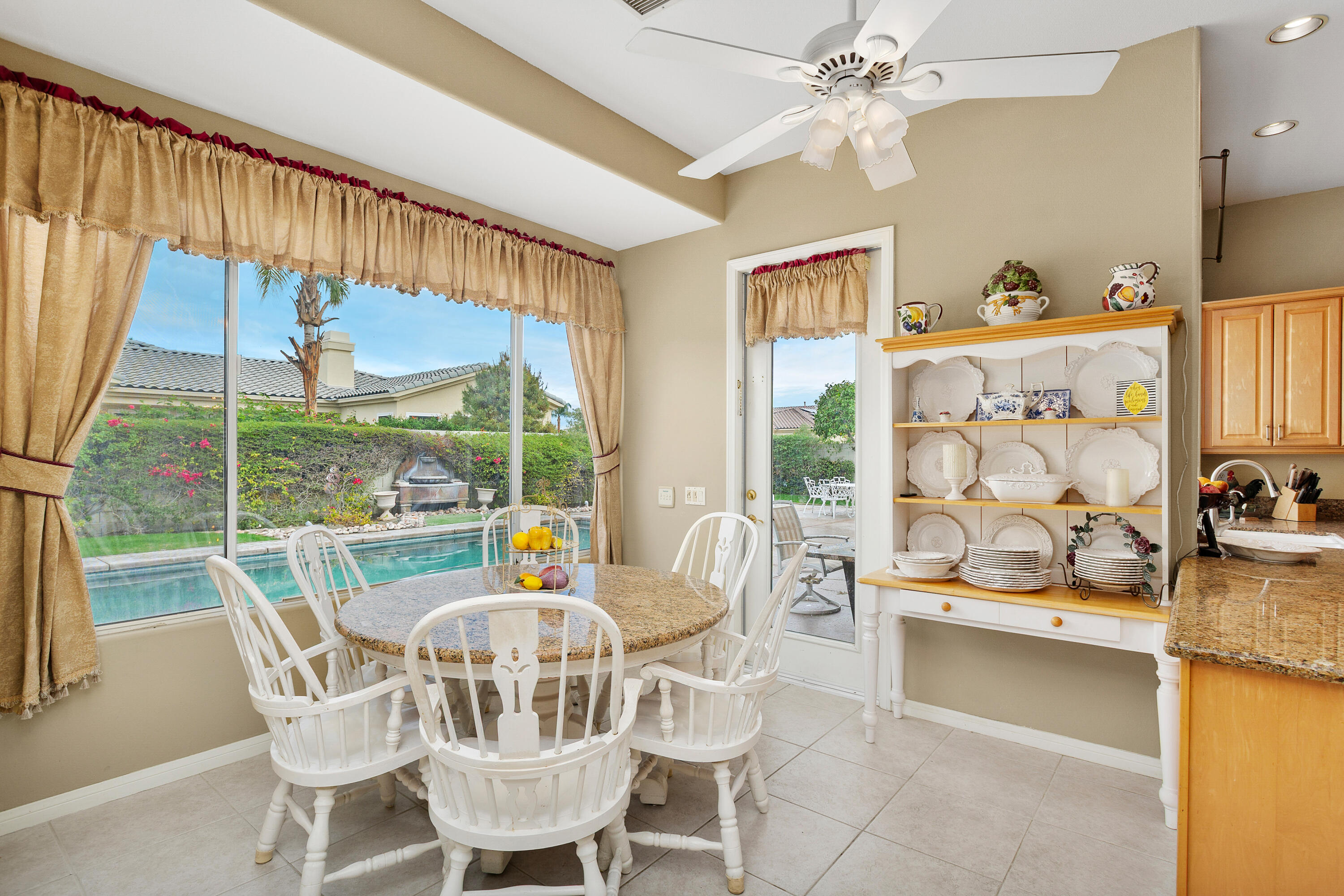 2 Othello Court Rancho Mirage, CA 92270 - Photo 15 of 45 a view of a dining room with furniture window and outside view