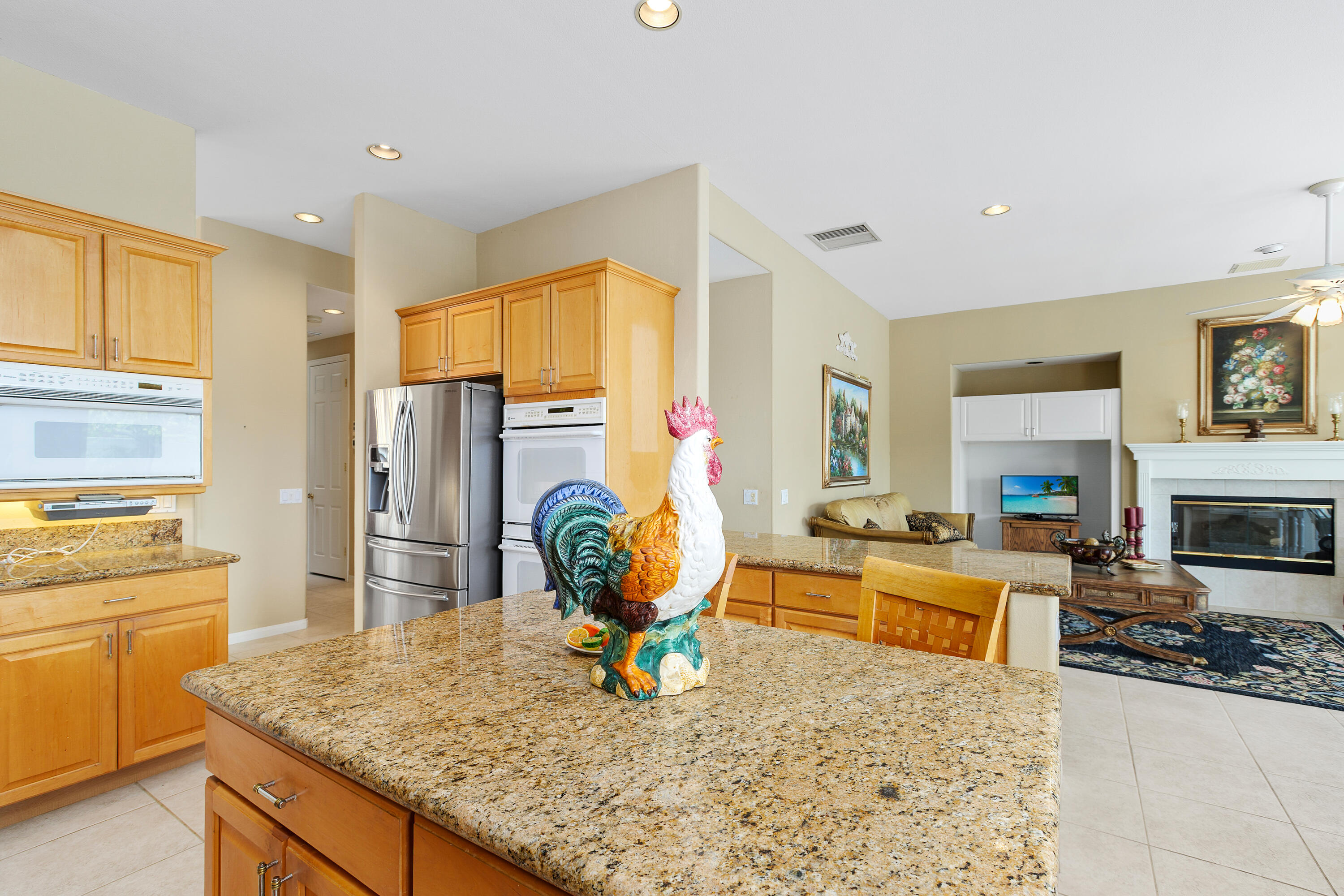 2 Othello Court Rancho Mirage, CA 92270 - Photo 17 of 45 a living room with furniture appliances and a kitchen view