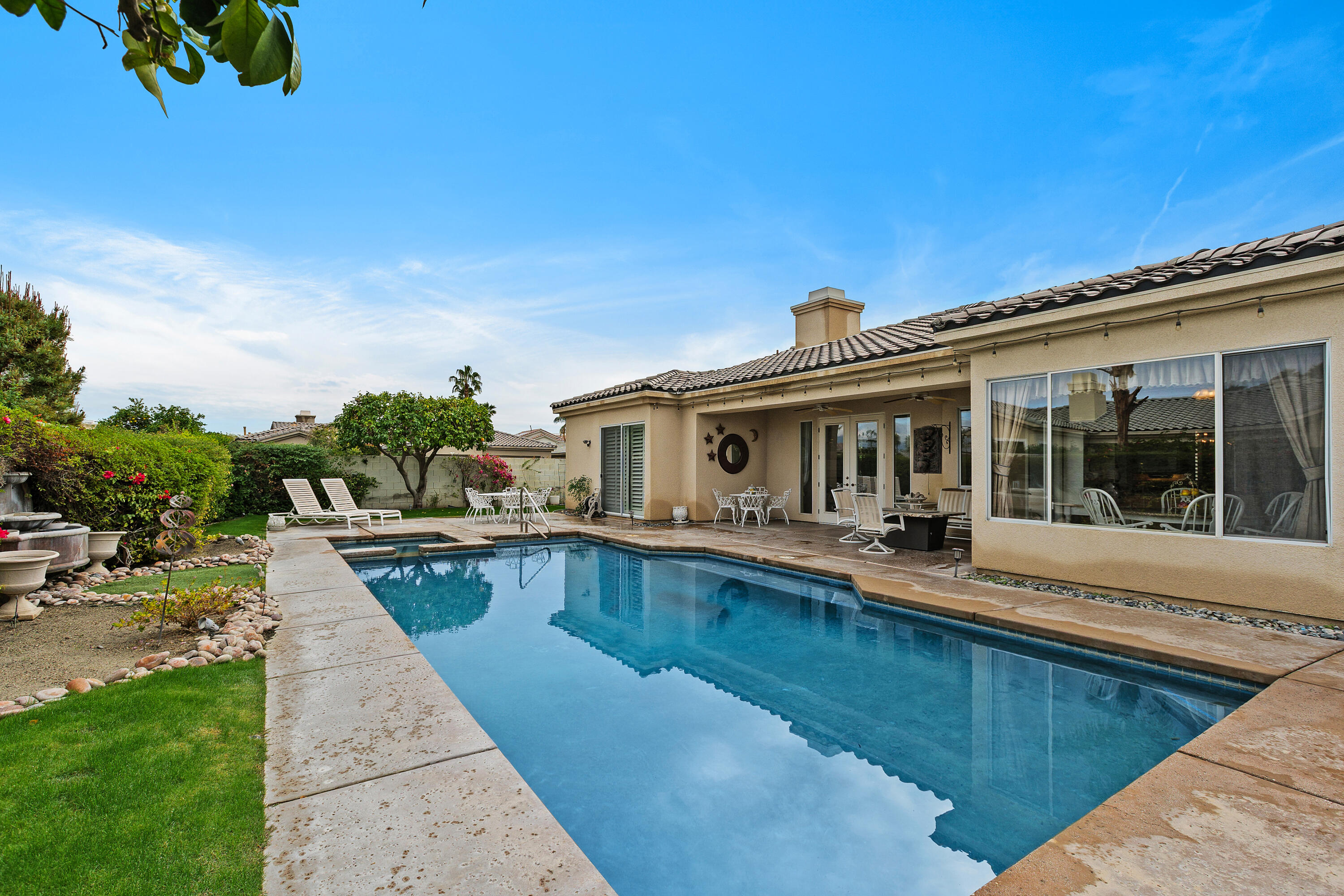 2 Othello Court Rancho Mirage, CA 92270 - Photo 2 of 45 a view of a house with swimming pool and sitting area