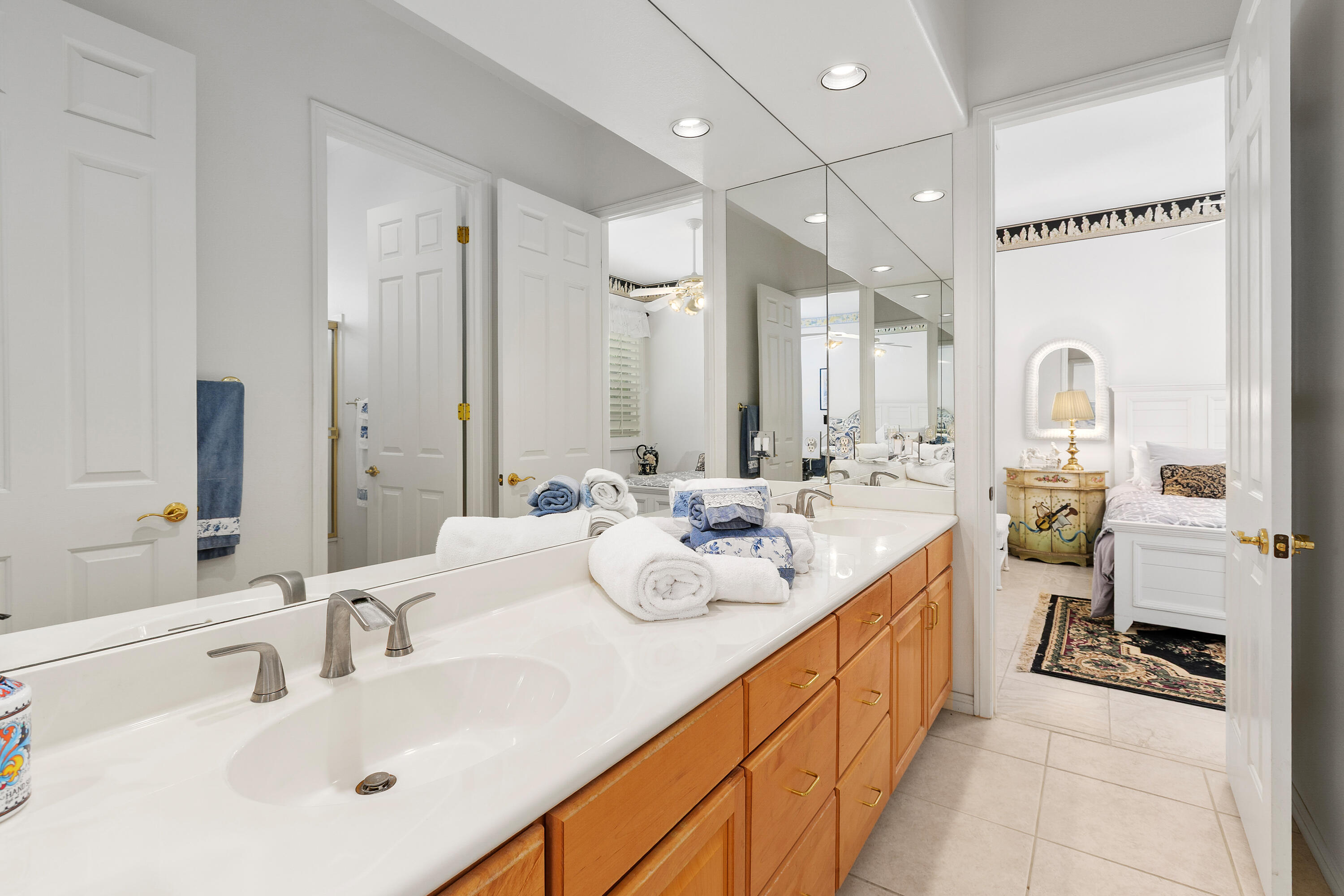 2 Othello Court Rancho Mirage, CA 92270 - Photo 21 of 45 a bathroom with a double vanity sink mirror and