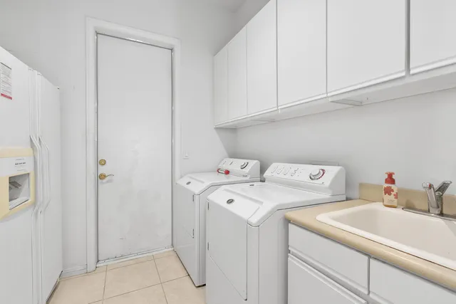 a white toilet sitting next to a bathroom sink