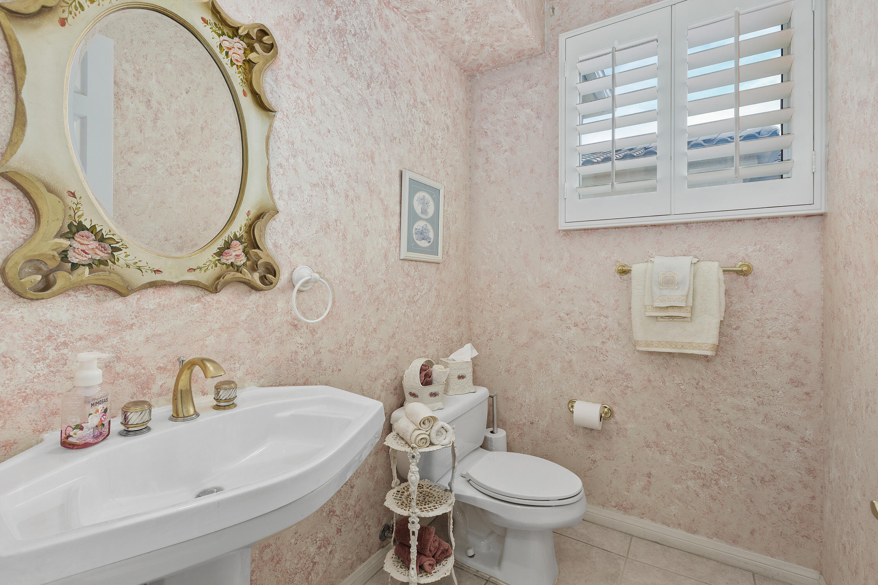 2 Othello Court Rancho Mirage, CA 92270 - Photo 24 of 45 a white toilet sitting next to a bathroom sink