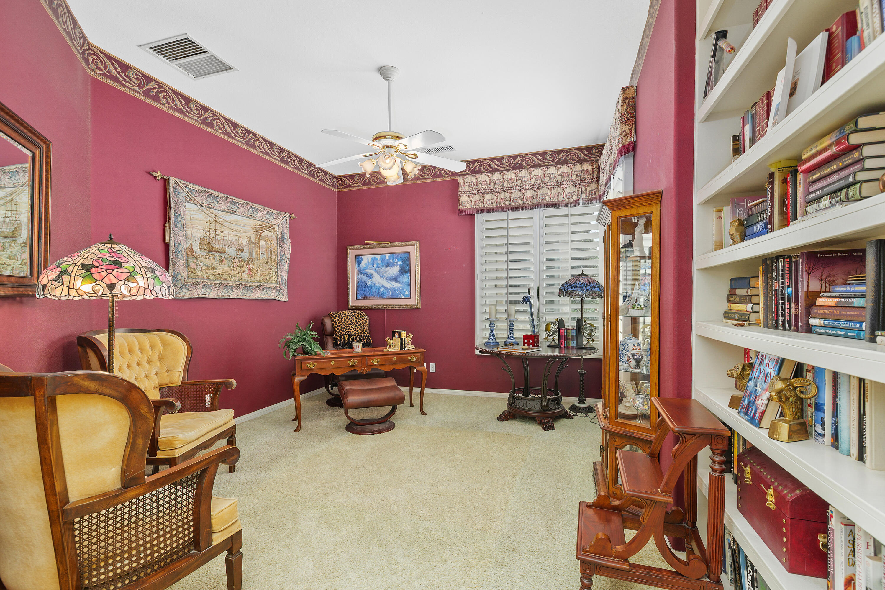 2 Othello Court Rancho Mirage, CA 92270 - Photo 25 of 45 a bedroom with furniture and a book shelf