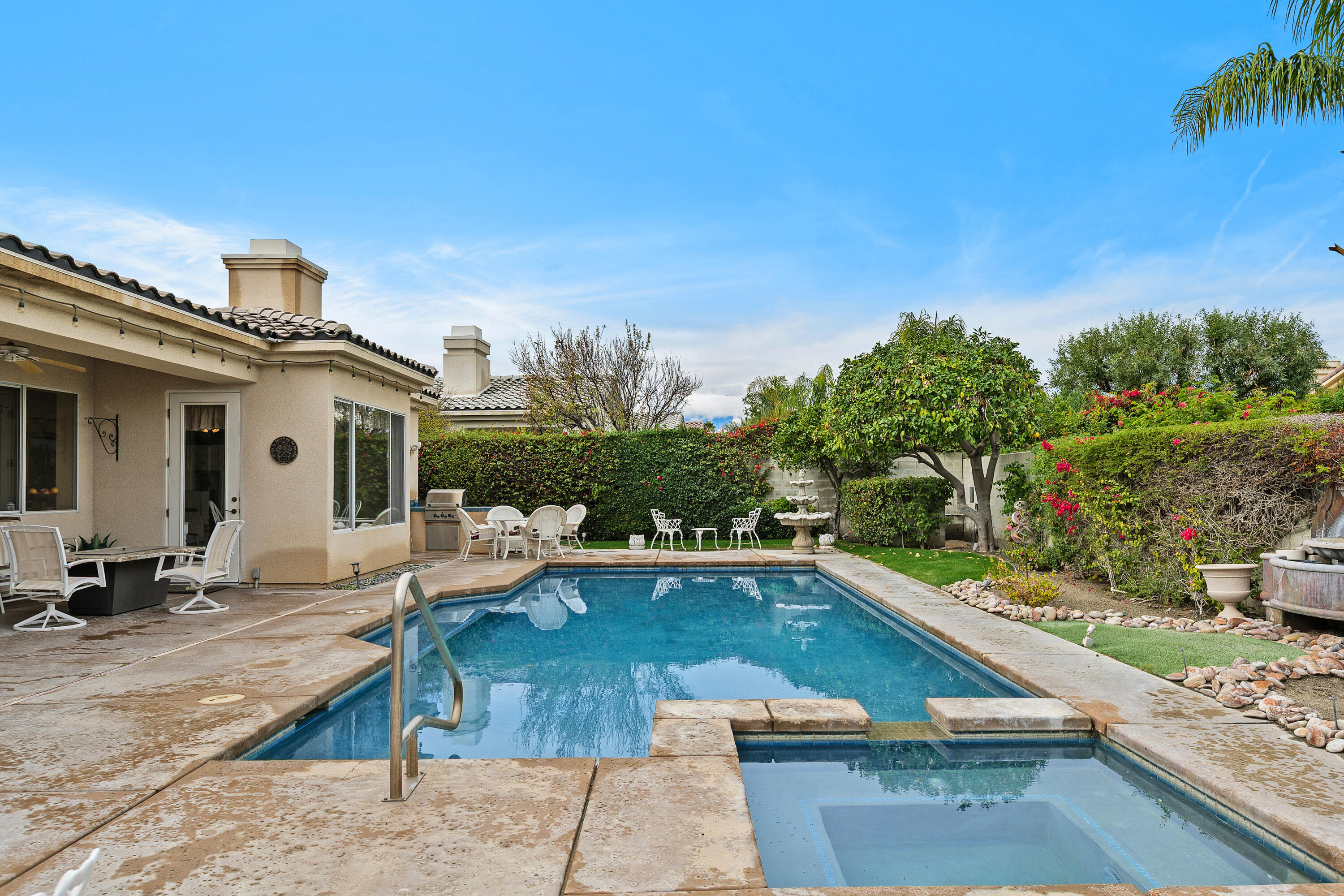 2 Othello Court Rancho Mirage, CA 92270 - Photo 33 of 45 a view of a swimming pool with lounge chair