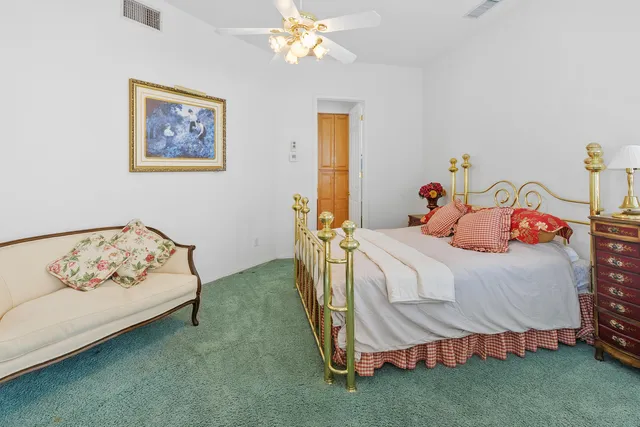 a bathroom with a double vanity sink mirror and shower