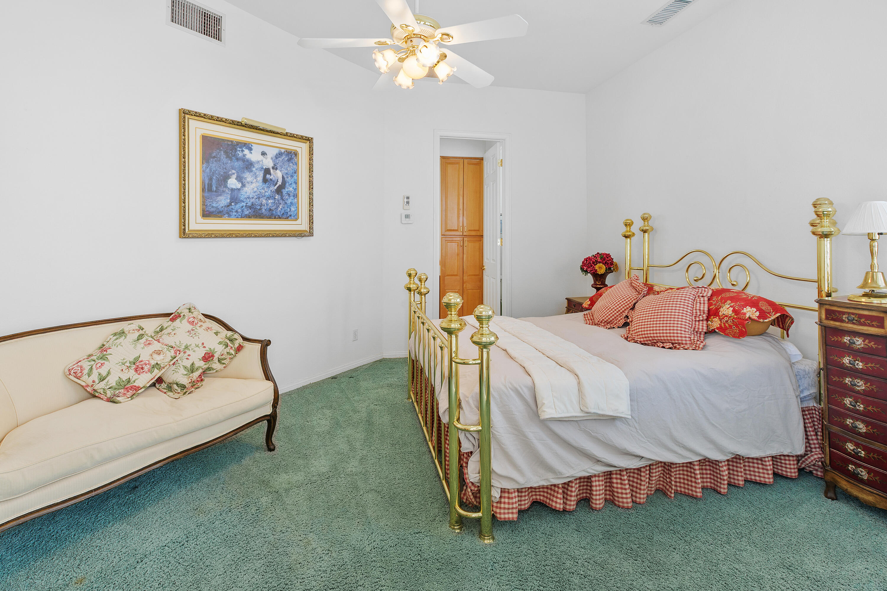 2 Othello Court Rancho Mirage, CA 92270 - Photo 38 of 45 a bedroom with a bed and a chandelier