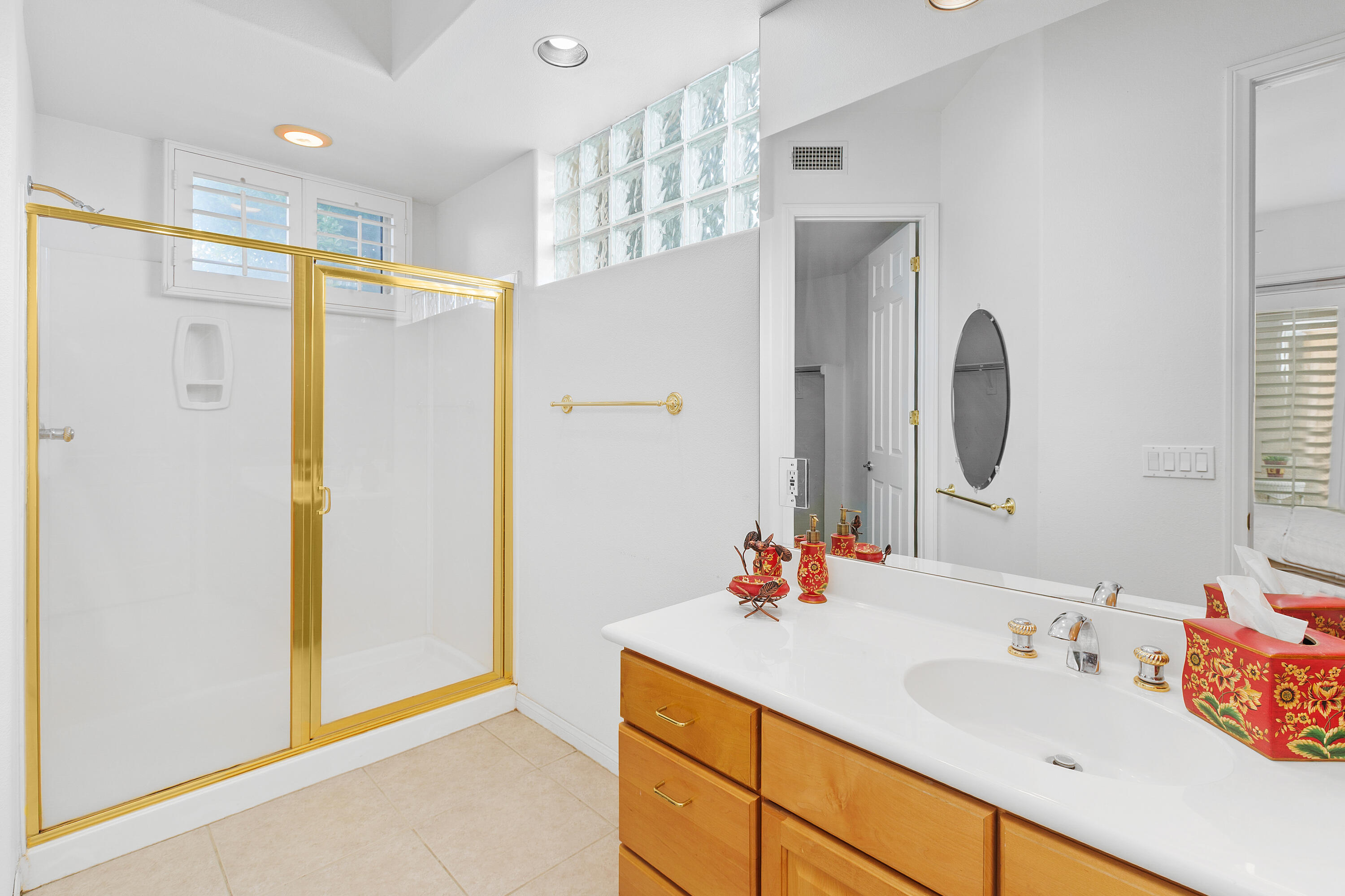 2 Othello Court Rancho Mirage, CA 92270 - Photo 39 of 45 a bathroom with a double vanity sink mirror and shower